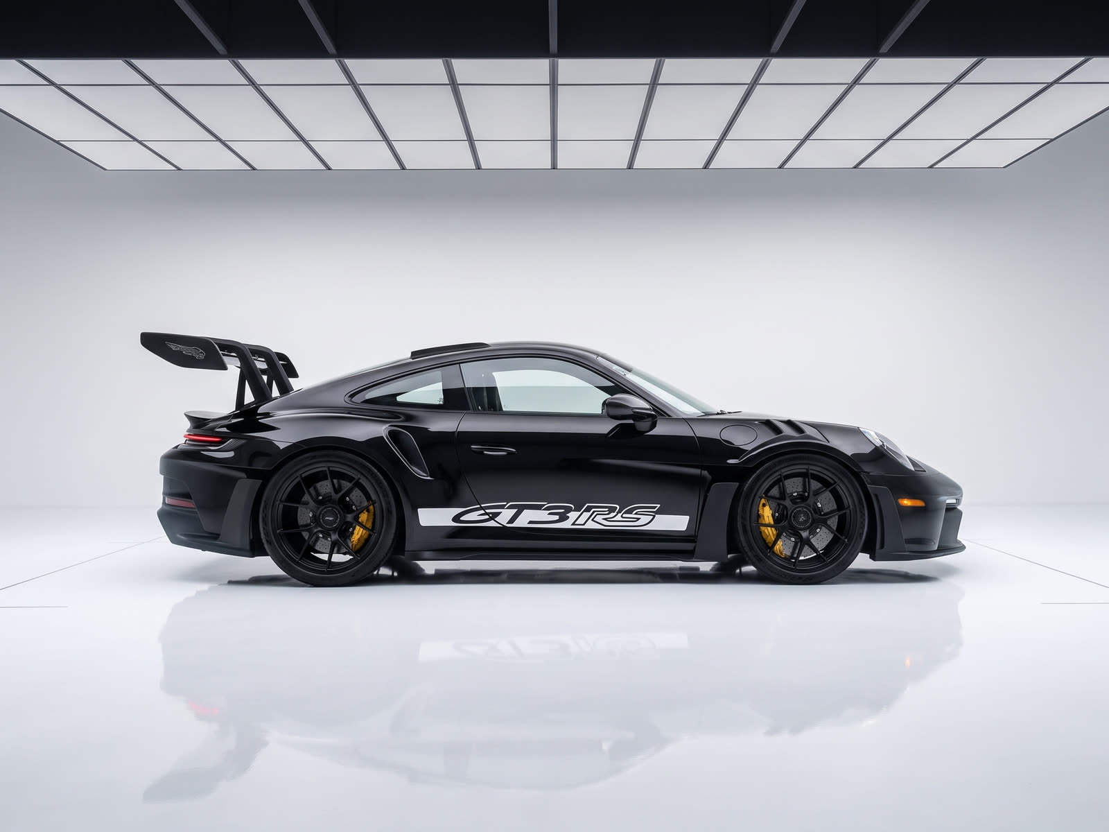 Porsche 911 GT3 RS in profile under studio lighting